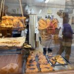 Baskets of bread in the window of a traditional Spanish bakery