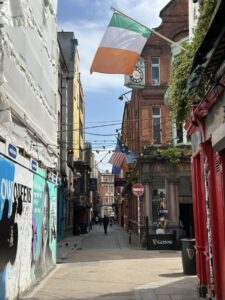A lane in Temple Bar, Dublin, with the Irish flag flying
