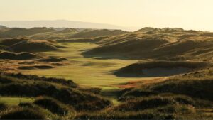 Links dunes glowing at golden hour on Ireland's coast
