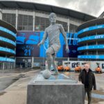 JP Cone beside the David Silva statue outside Manchester City's Etihad Stadium