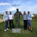 An EGT group with the Arnold Palmer statue at Tralee Golf Links, County Kerry