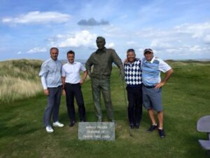 An EGT group with the Arnold Palmer statue at Tralee Golf Links, County Kerry