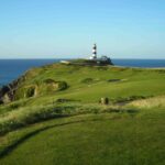 Golf on the Old Head of Kinsale, County Cork, lighthouse beyond