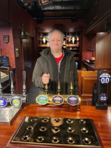 JP Cone behind the bar at the Rovers Return Inn on the Coronation Street set