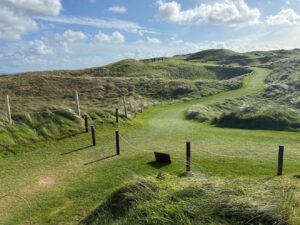 Golden evening light across an Irish links course