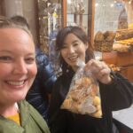 EGT guests with a bag of local pastries in a Spanish bakery