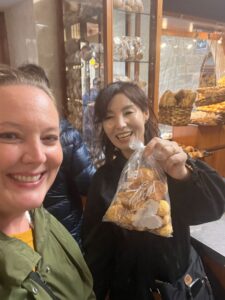 EGT guests with a bag of local pastries in a Spanish bakery