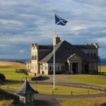 The clubhouse at Kingsbarns Golf Links in Scotland, the Saltire flying above the links