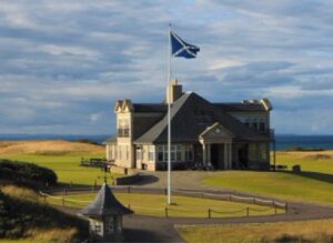 The clubhouse at Kingsbarns Golf Links in Scotland, the Saltire flying above the links