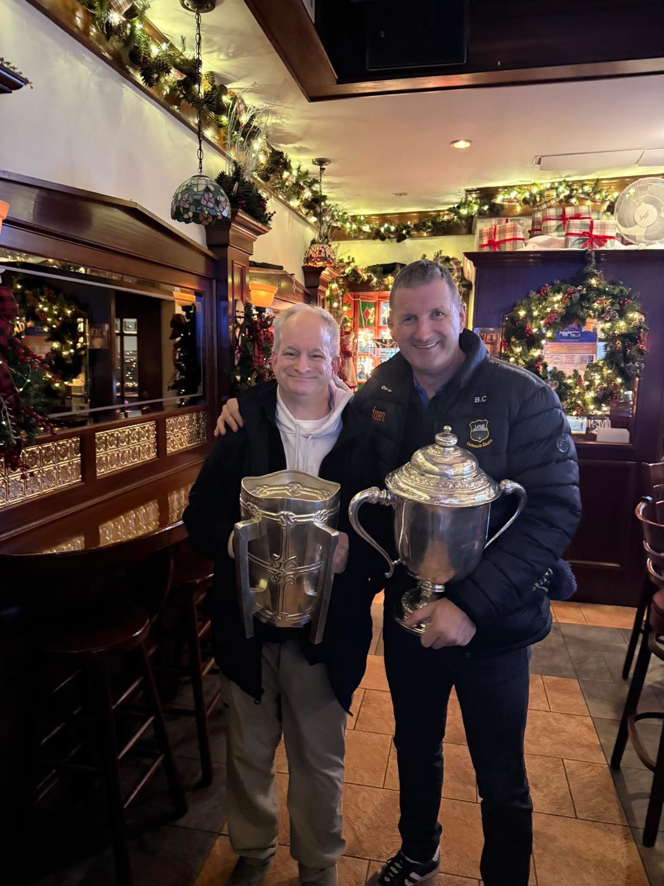 JP Cone with Brendan Cummins, the Liam MacCarthy Cup and the Sam Maguire Cup
