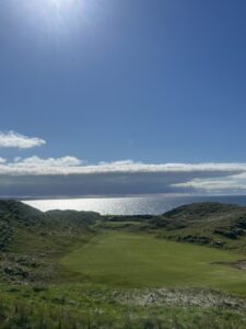 A links fairway running through the dunes towards the sea in Ireland