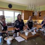 Guests learning traditional Irish baking at a country-house cookery class