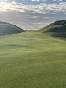 A links fairway framed by towering dunes in Ireland