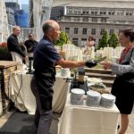 A raclette station at a Swiss food day on a New York rooftop