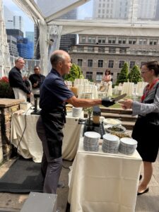 A raclette station at a Swiss food day on a New York rooftop