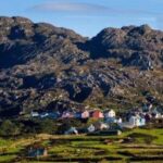Colourful houses of a West Cork village beneath the Beara mountains