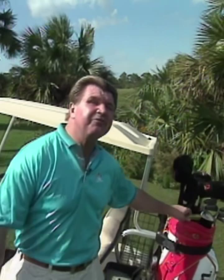 Mike Ditka, cigar in hand, on the golf course during his television programme For the Good of the Game