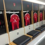 Manchester United shirts hanging in the home dressing room at Old Trafford