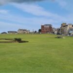 Looking across the Old Course at St Andrews towards the Swilcan Bridge and the town