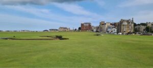 Looking across the Old Course at St Andrews towards the Swilcan Bridge and the town