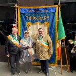 JP Cone at the Tipperary 150th anniversary banner on parade day in New York