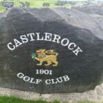 The entrance stone at Castlerock Golf Club in County Londonderry, Northern Ireland — the club's gold lion crest and its founding year, 1901