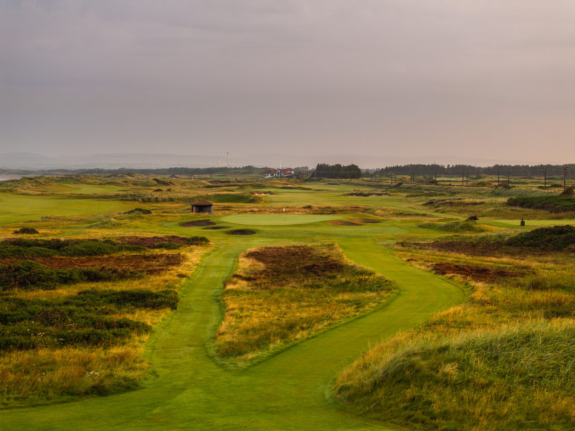 Looking down a Western Gailes fairway towards the clubhouse, the railway line on the right, Ayrshire